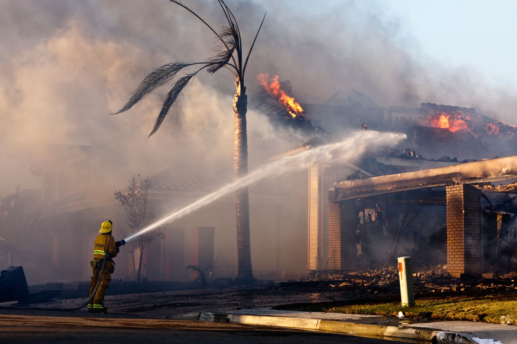 A fireman fights a house fire