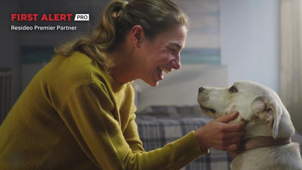 A woman cares for her dog by taking care of pet safety