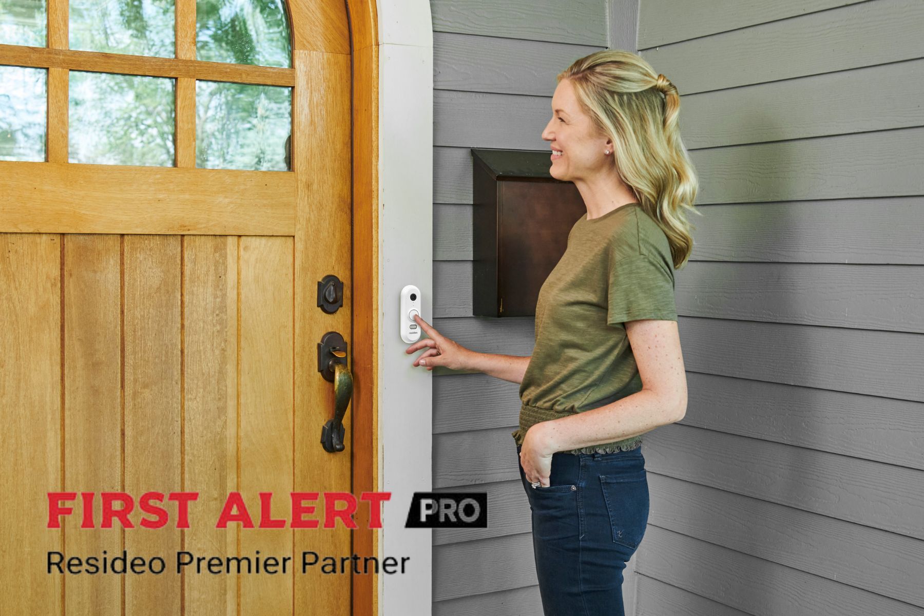 A woman at the front door of a home pressing the call button on a video doorbell